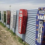Memorial coffins on the US-Mexico barrier for those killed crossing the border fence
